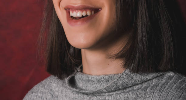 istock womans tongue teeth lips 1198795333