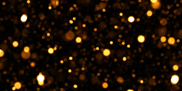 istock Golden Glittering Defocused Lights Abstract Background 1198797381