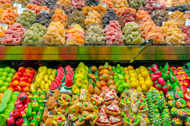 La Boqueria market with sweets, candies and dried fruits in Barcelona, Spain.