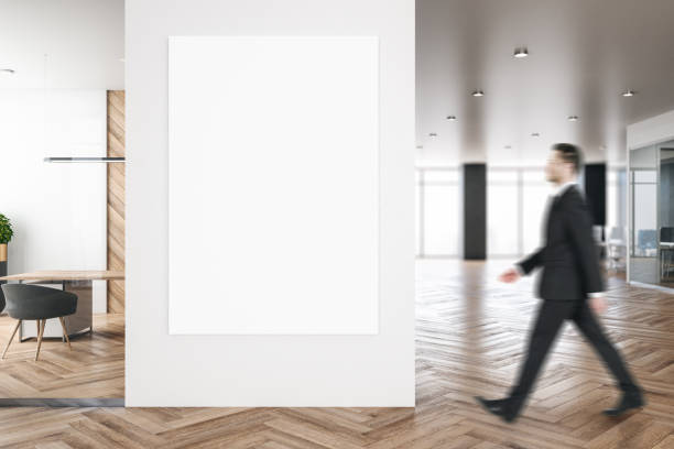 istock Businessman in modern office with billboard 1198803904
