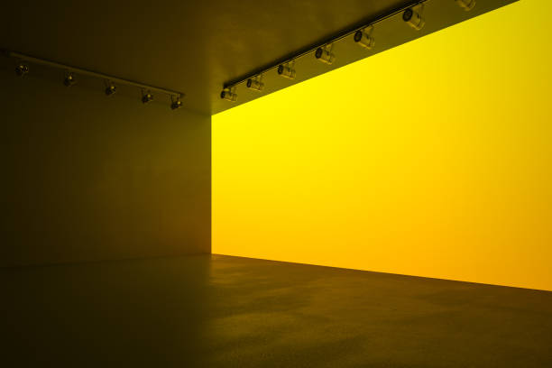 istock Modern style hall with blank yellow wall, lights and concrete floor, mock up. 1198804391