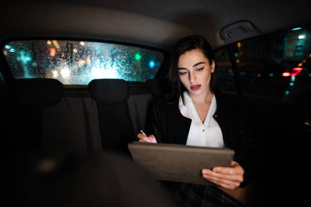 istock Businesswoman reading e-mails on her digital tablet 1198804586