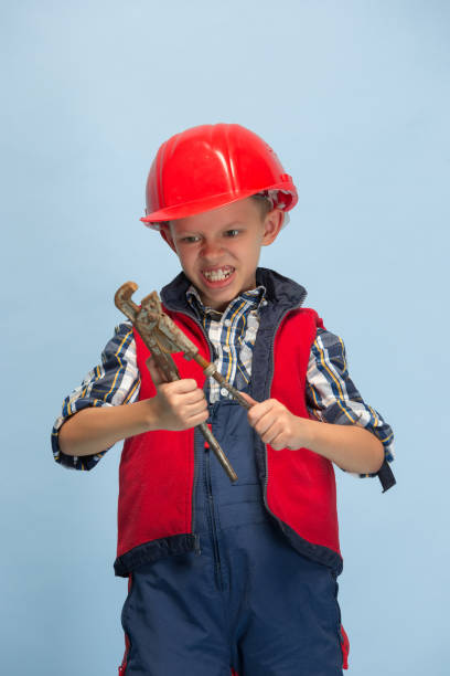istock Boy dreaming about future profession of engineer 1198805779