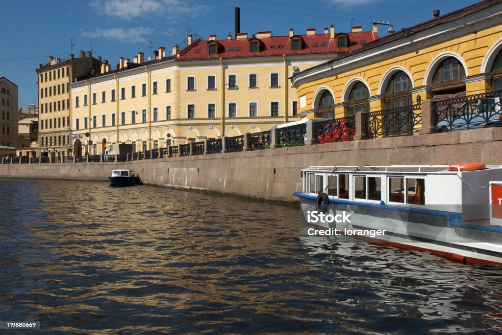 Colorful bank of the Moïka Canal Shore of Moïka Canal in St. Petersburg, Russia, lined with colourful neoclassical buildings. Architecture Stock Photo