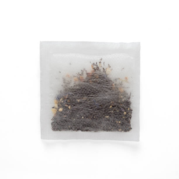 istock Tea bag with black Earl Grey in rectangle shape isolated on white background 1198810933