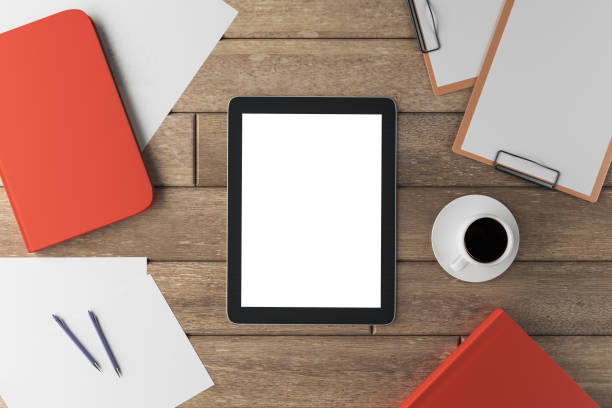 istock Wooden office desktop with white tablet 1198812856