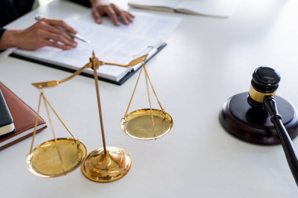 istock Close-Up Of Balance With Gavel On Table 1198812929