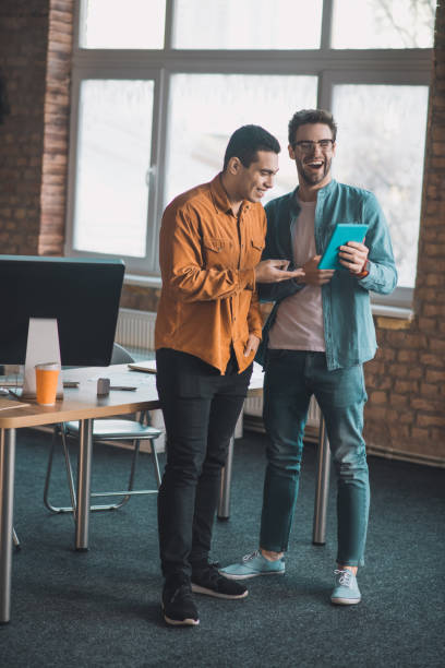 istock Nice happy men talking to each other 1198814188