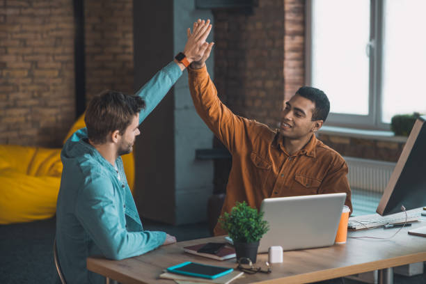 istock Nice young men giving each other high five 1198814234