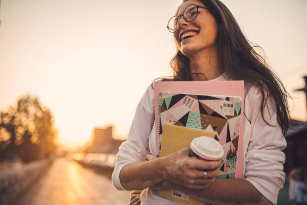 istock Joyful girl leaving univesity 1198814806