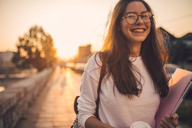 istock Girl leaving campus on a beautiful sunset 1198814809