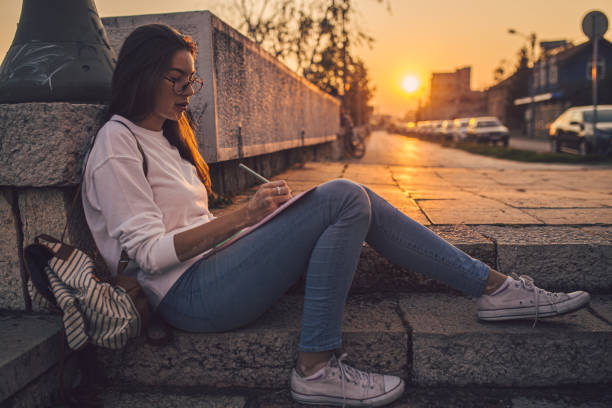istock Girl doing creative relaxation on stone stairs 1198814814