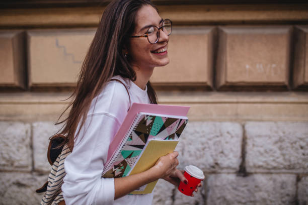 istock Girl smiling and rushing to lectures 1198814816