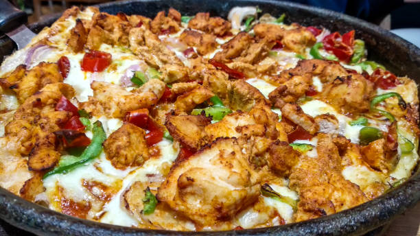 istock Butter Chicken Cheese Pizza 1198817136