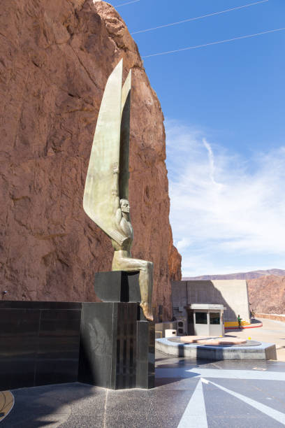 Winged Figures of the Republic, Boulder City, USA Boulder City, Nevada, USA- 01 June 2015: Winged Figures of the Republic at Hoover Dam. Concrete gravitational arc dam, built in the Black Canyon on the Colorado River. hoover dam statues stock pictures, royalty-free photos & images