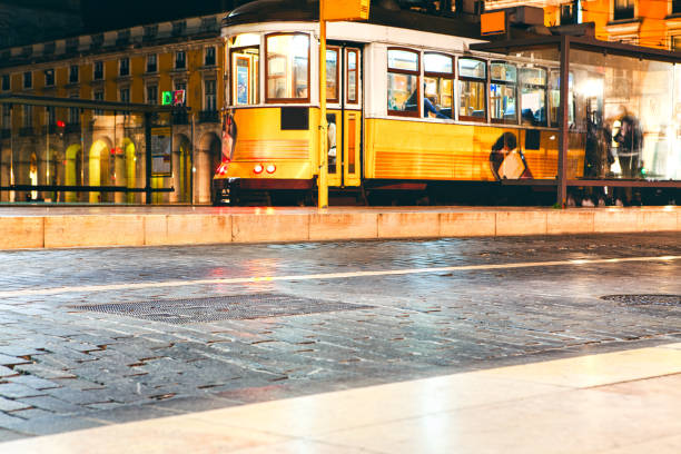 istock yellow tram on the night street 1198821873