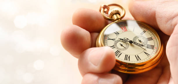 istock Time - Vintage gold pocket watch in hand. Copy space 1198822233