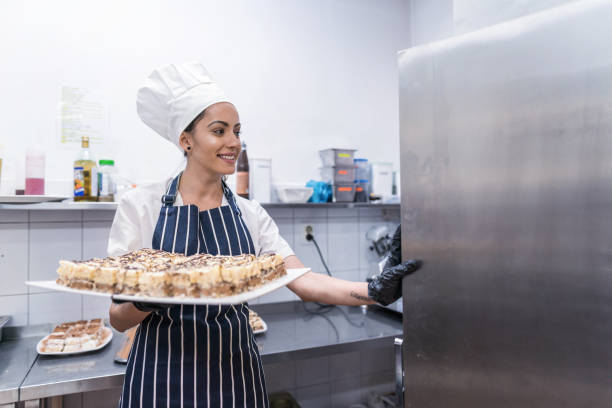 Professional female chef working in the kitchen