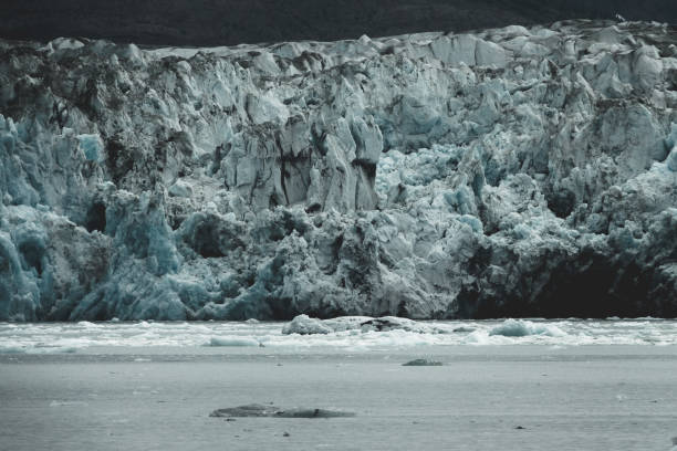 Columbia glacier, Alaska, passing through ice filled waters and mountains, United States of America