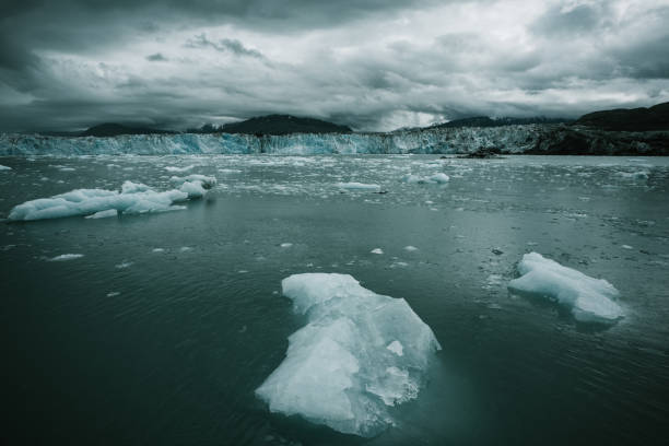 Columbia glacier, Alaska, passing through ice filled waters and mountains, United States of America