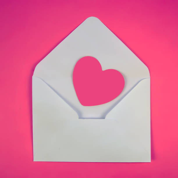 istock pink heart in a white envelope 1198829955