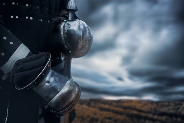 istock Crop of knight holding sword. 1198830931