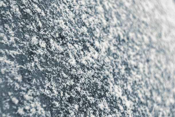 istock Snowflakes on a car glass close-up. 1198831577
