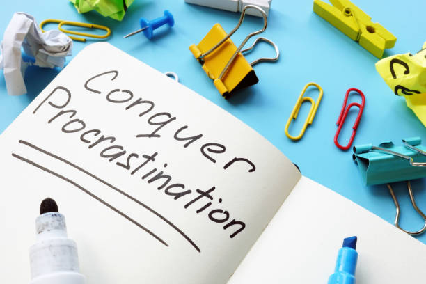 istock Conquer Procrastination phrase in the reminder on the desk. 1198833834
