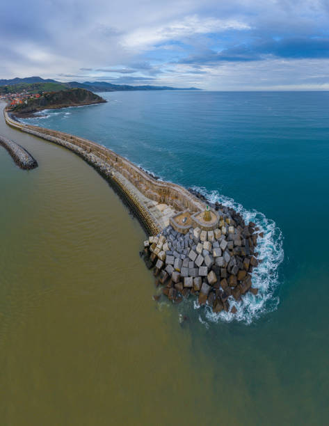 concrete block cubes seawall and breakwater in zumaia - commercial dock pier reef rock imagens e fotografias de stock