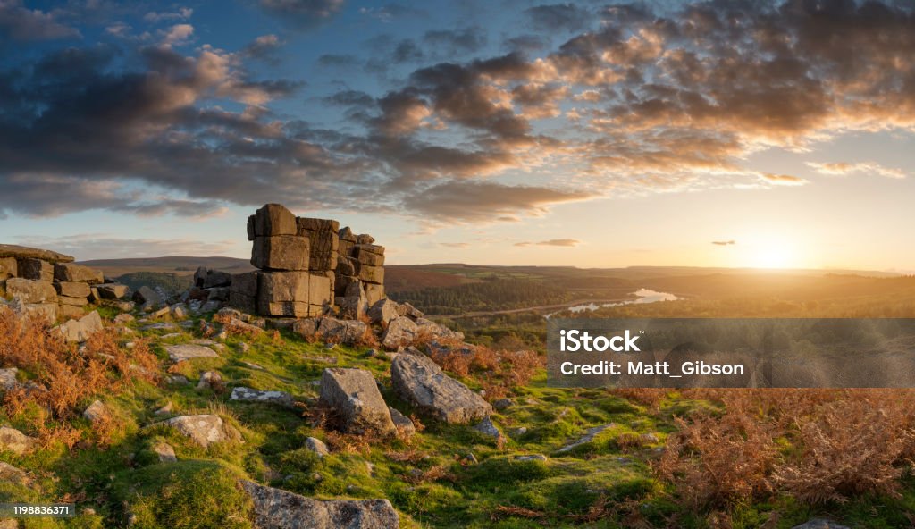 Majestic sunset over landscape of Leather Tor in Dartmoor during Summer with dramatic sky Epic sunset over landscape of Leather Tor in Dartmoor during Summer with dramatic sky Dartmoor Stock Photo