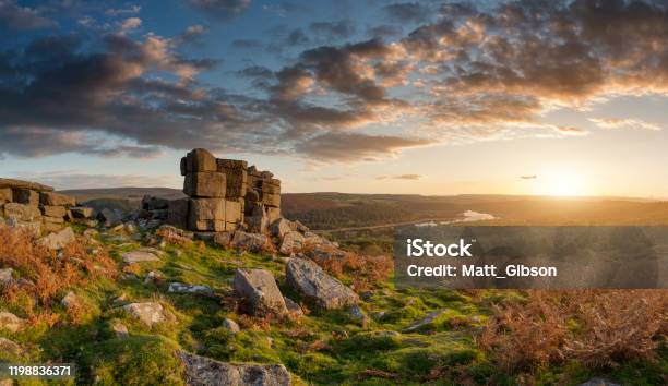 Majestic Sunset Over Landscape Of Leather Tor In Dartmoor During Summer With Dramatic Sky Stock Photo - Download Image Now