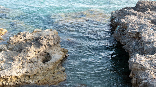 istock Rocks and sea on a late September afternoon 1198837390