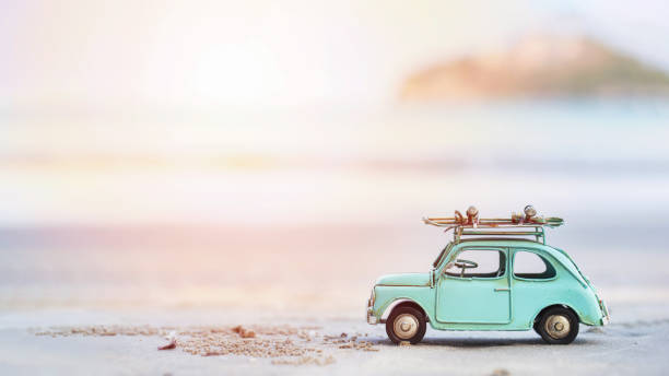 Miniature  tin car  closeup at summer beach scene