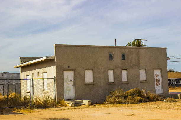 istock Abandoned Building With Boarded Up Windows 1198838994