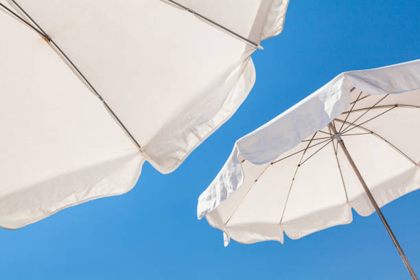 umbrellas on the riviera - parasol imagens e fotografias de stock