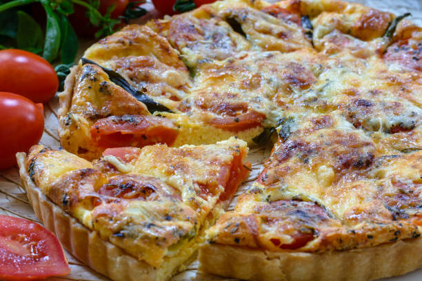 istock French pie . Quiche lorraine with tomatoes cherry, basil and cheese 1198848586
