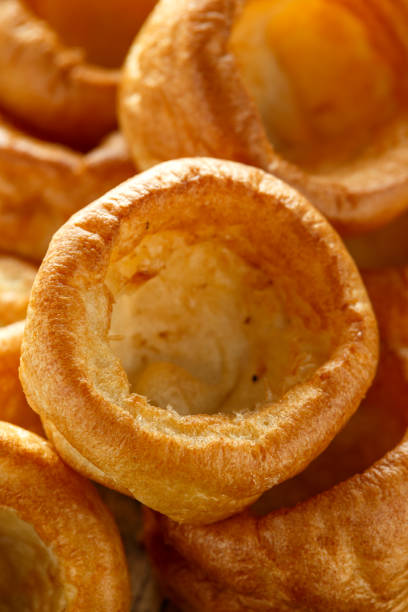 istock Traditional English Yorkshire pudding side dish on black plate and background 1198850716