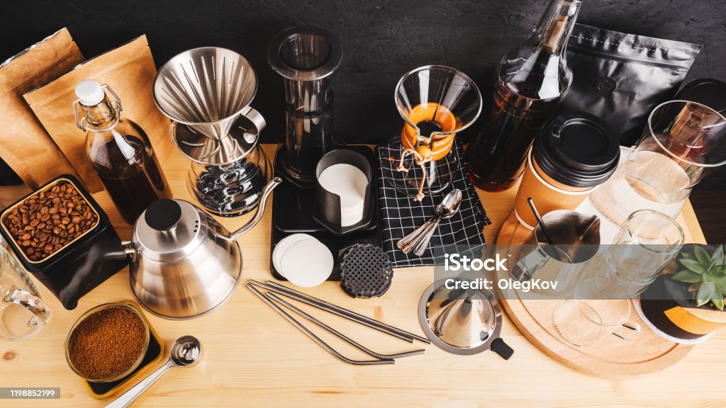 https://media.istockphoto.com/id/1198852199/photo/accessories-and-utensils-for-making-coffee-using-alternative-methods-wooden-table-in-the.jpg?s=1024x1024&w=is&k=20&c=o_1zyQ3t8Awktqe34CKxbNMHlkK5vI0fF56CrtfEC64=