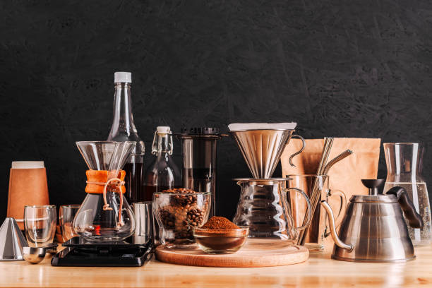 istock Accessories and utensils for making coffee drinks on a wooden table, coffee shop interior 1198853769