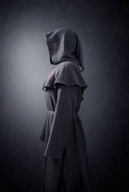 istock Scary figure in hooded cloak 1198857414
