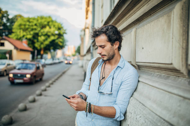 istock Man using phone in the city 1198857827