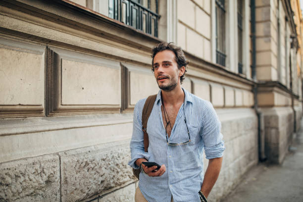 istock Man using phone in the city 1198857866