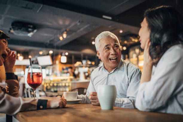 istock Friends drinking coffee in cafe 1198860342
