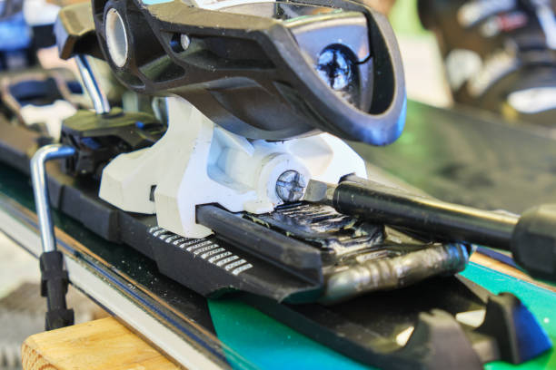 istock Screw for adjusting forward pressure in a ski binding using a screwdriver, after clipping the ski boot in first. 1198860403