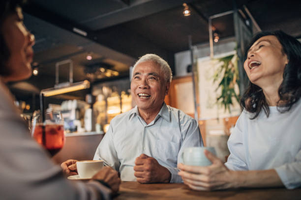 istock Friends drinking coffee in cafe 1198860423