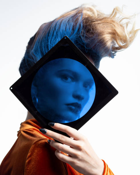 istock Woman looking through blue lens 1198861512
