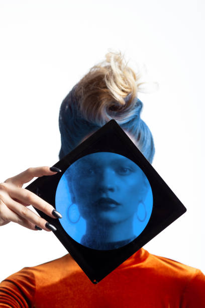 istock Woman looking through blue lenc 1198861583