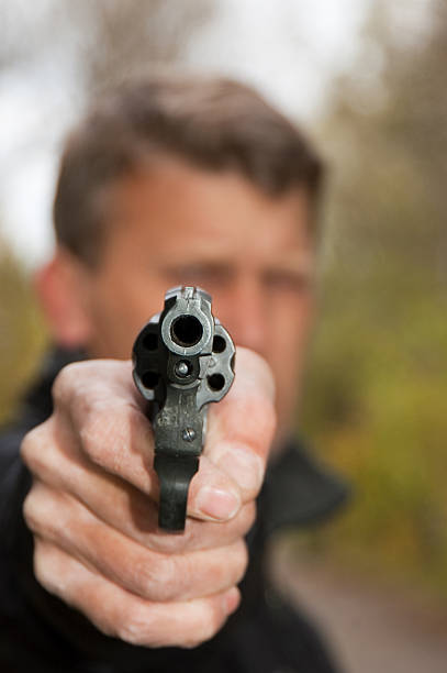istock The man aims from revolver 119886196