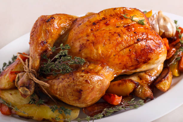 istock Roast whole chicken with roast vegetables, 1198864038