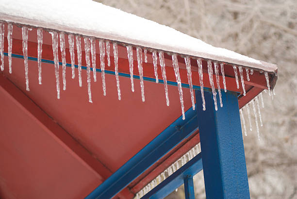 istock Many icicles on color roof 119886740